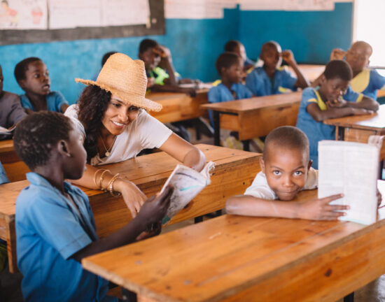 Manuela Testolini rads to a group of students in a school in Malawi