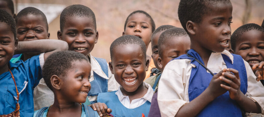 a group of young children going to school in Malawi
