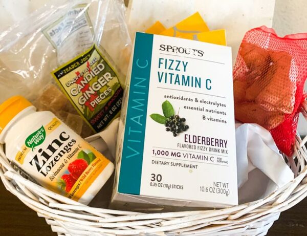 immunity care package with Zinc and Vitamin C and candied ginger in a white basket