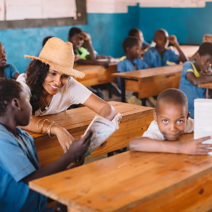 IAPW Manuela Testolini reading with students in Malawi
