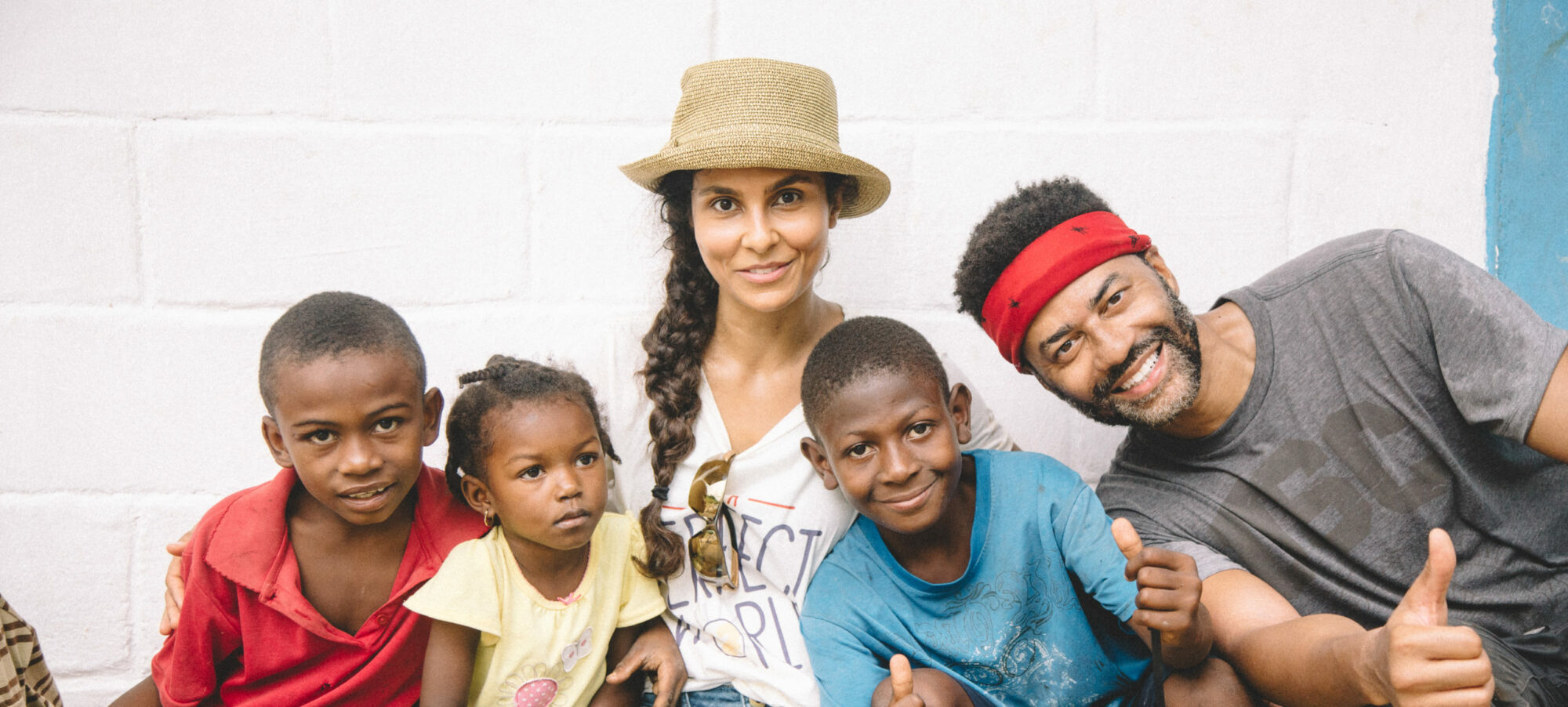 Manuela Testolini and Eric with kids in Haiti