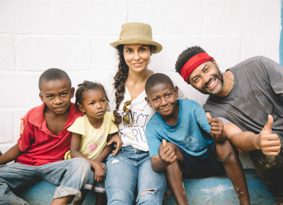 Manuela Testolini and Eric with kids in Haiti